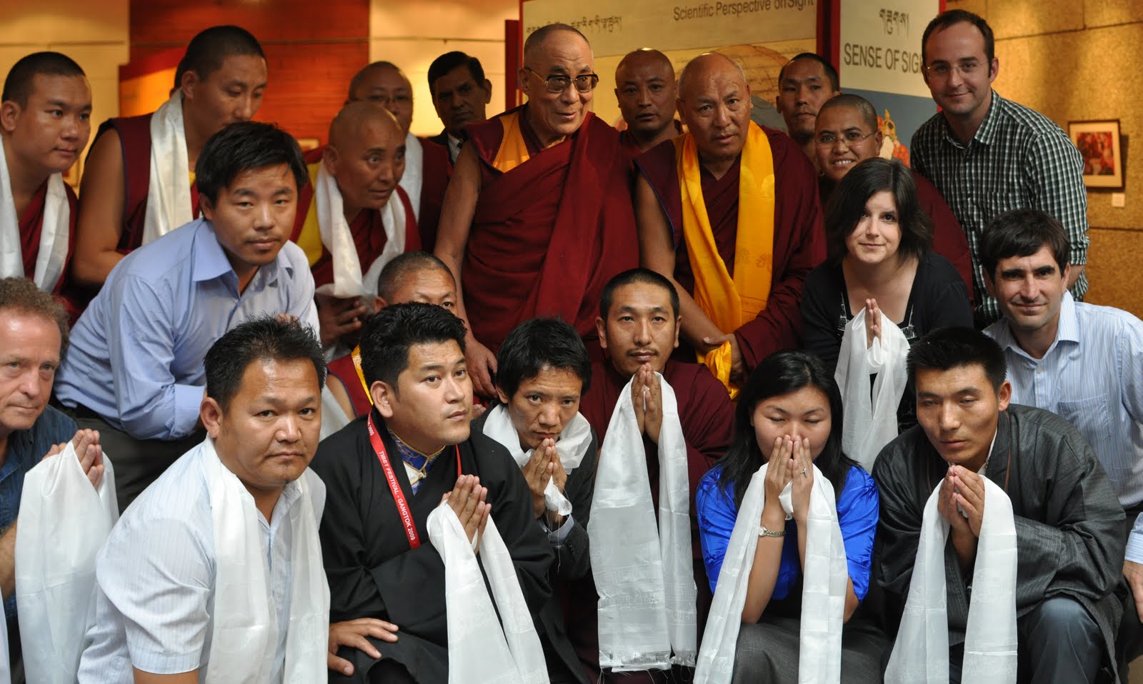 Group photo within the exhibition of His Holiness the 14th Dalai Lama and the project team.